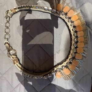 Costume necklace in a beautiful sand Color’s with a spike design.